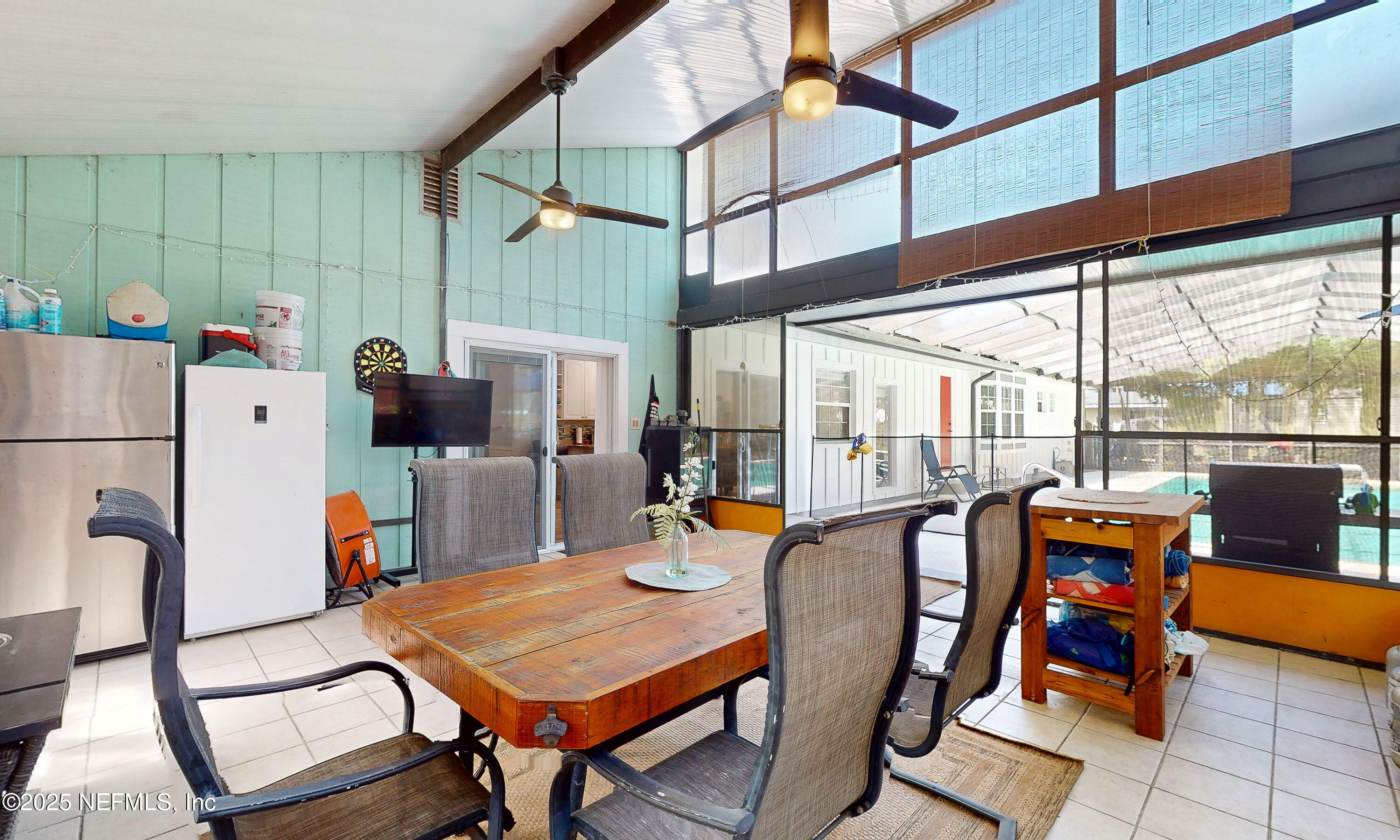 90 Forest Street Keystone Heights, FL 32656 - Photo 35 of 42 a dining room with furniture a chandelier and wooden floor