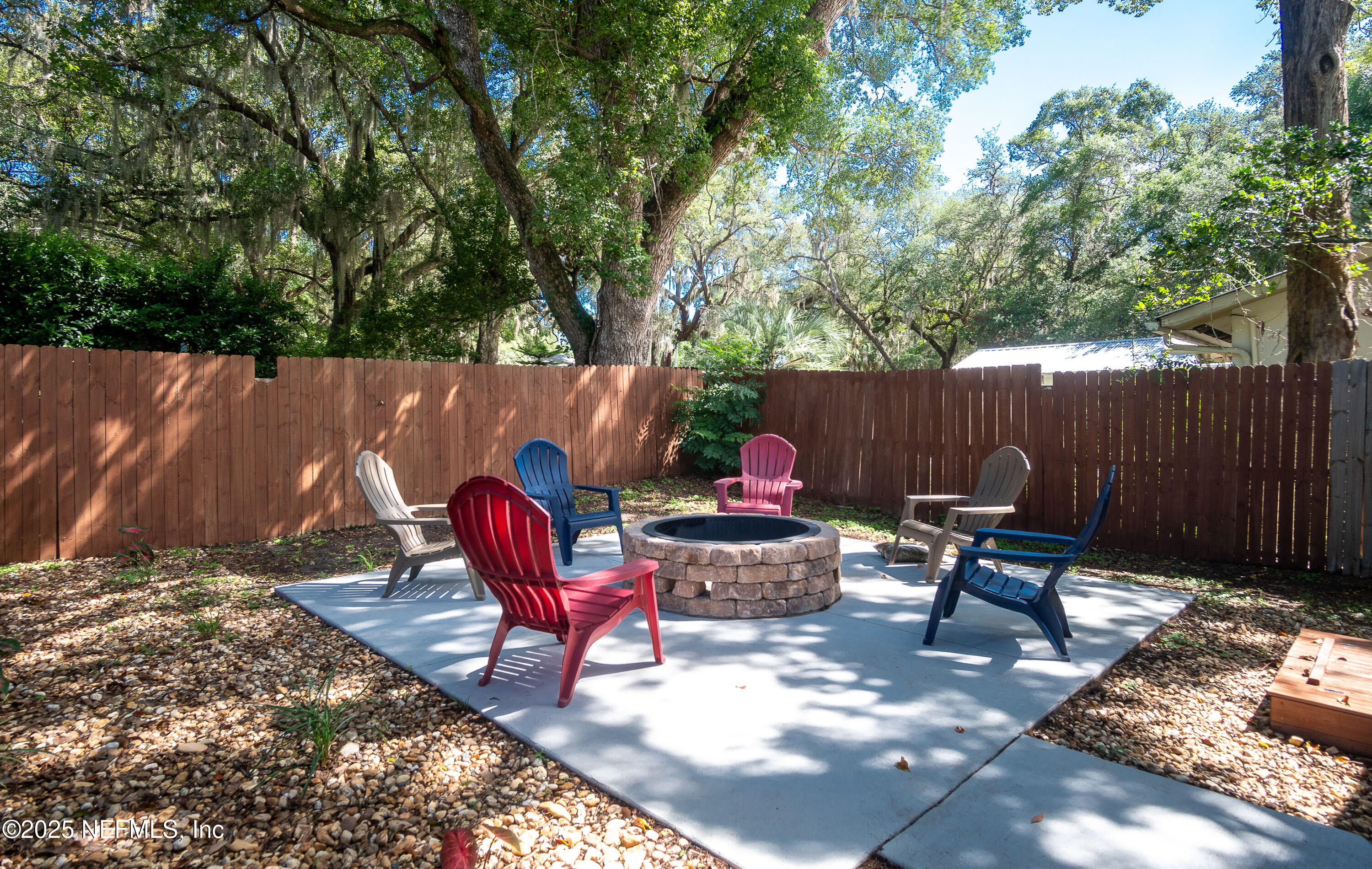 90 Forest Street Keystone Heights, FL 32656 - Photo 37 of 42 a backyard of a house with table and chairs