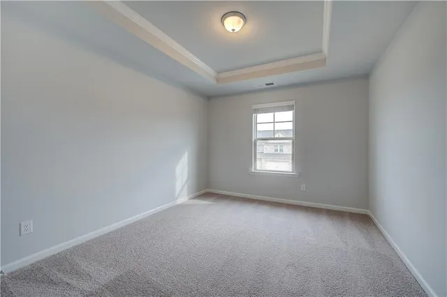 an empty room with a empty space and windows