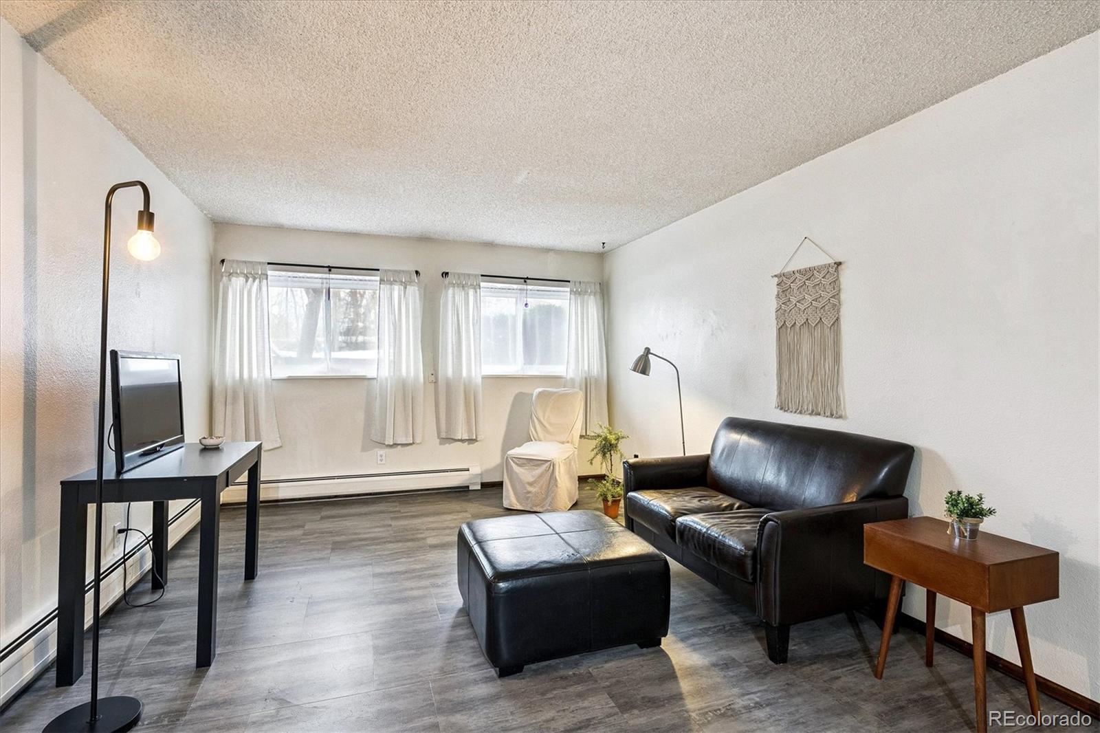 1300 Golden Circle, Unit 104 Golden, CO 80401 - Photo 12 of 26 a living room with furniture and a window