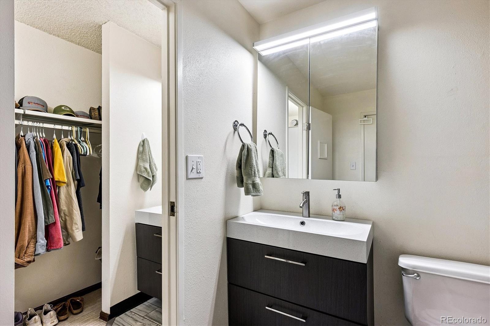 1300 Golden Circle, Unit 104 Golden, CO 80401 - Photo 18 of 26 a bathroom with a sink and a mirror