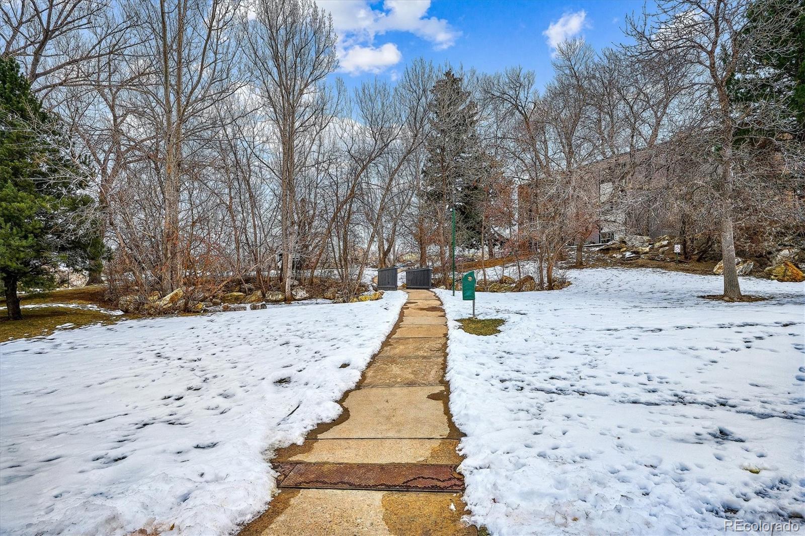 1300 Golden Circle, Unit 104 Golden, CO 80401 - Photo 24 of 26 a view of pathway covered with snow