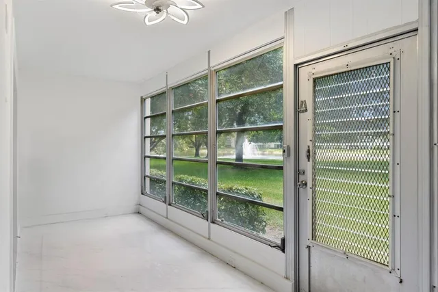 a view of a room with shelves on the wall