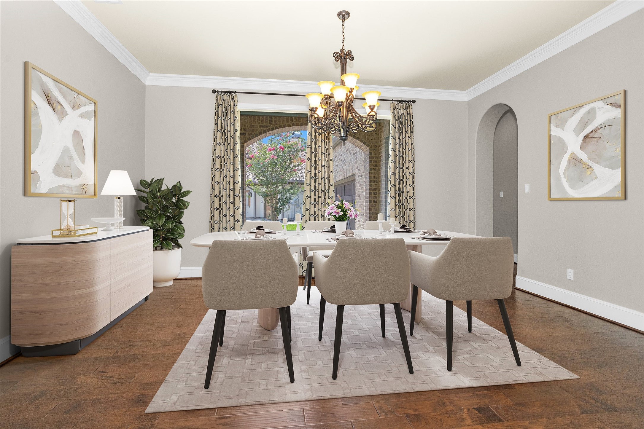 22 Marin Creek Place Spring, TX 77389 - Photo 6 of 36 Formal dining room featuring rich wood flooring, crown molding, and a decorative chandelier. Arched openings and architectural detailing frame a warm and inviting setting for entertaining. *Virtually Staged*
