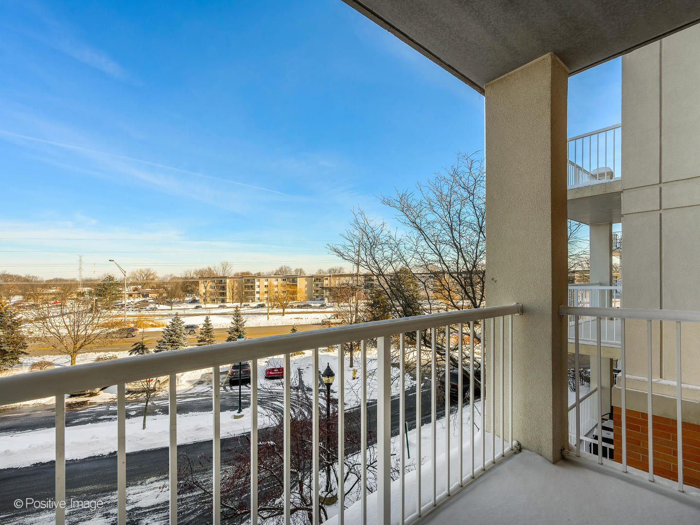 601 West Rand Road, Unit 307 Arlington Heights, IL 60004 - Photo 17 of 22 a view of a city from a balcony