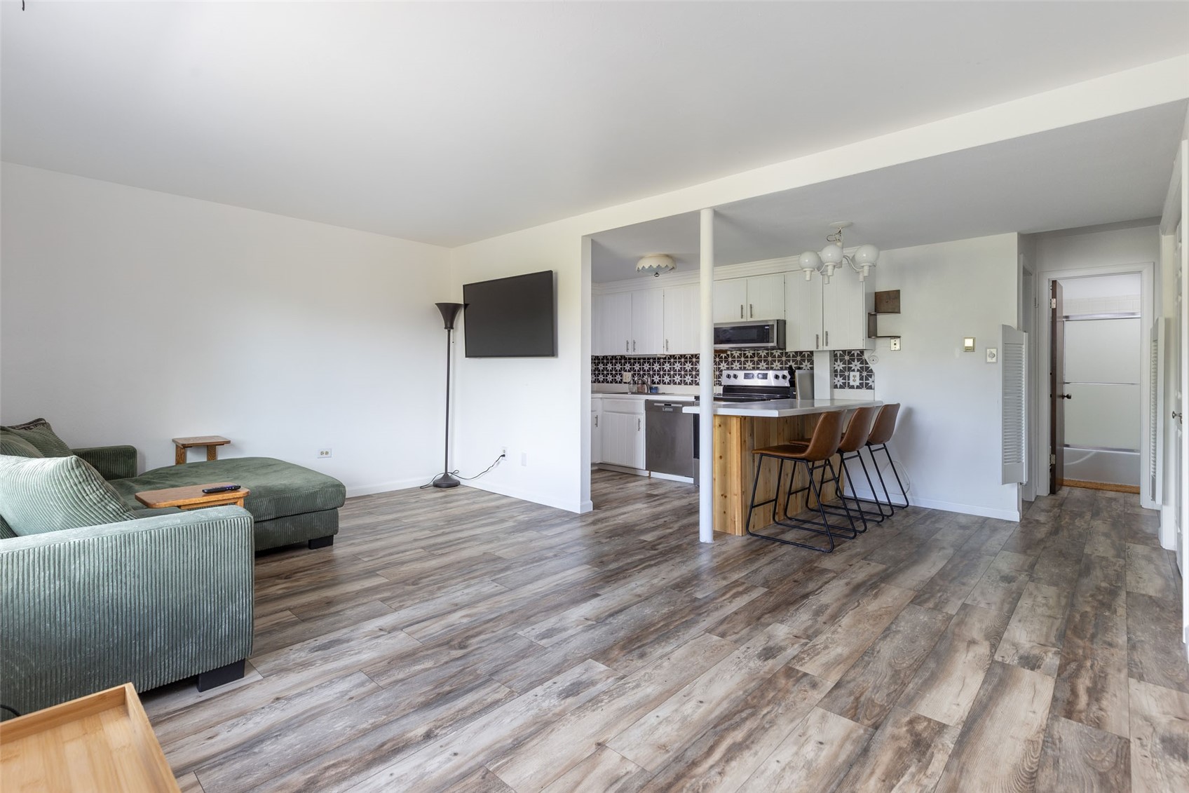 180 Evergreen Road, Unit 105 Dillon, CO 80435 - Photo 7 of 24 a living room with furniture and a wooden floor