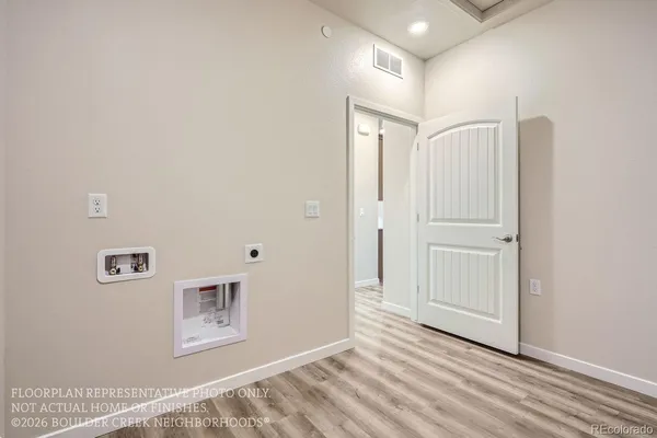a view of a livingroom with wooden floor