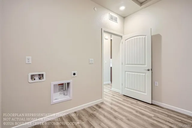 a view of a livingroom with wooden floor