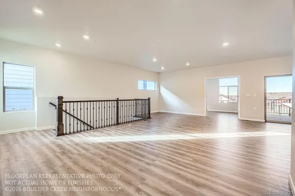 a view of a hall with wooden floor