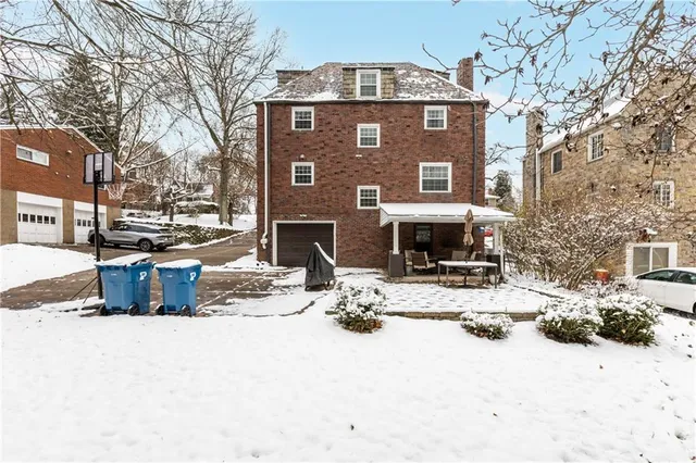 a view of a patio with a table and chairs