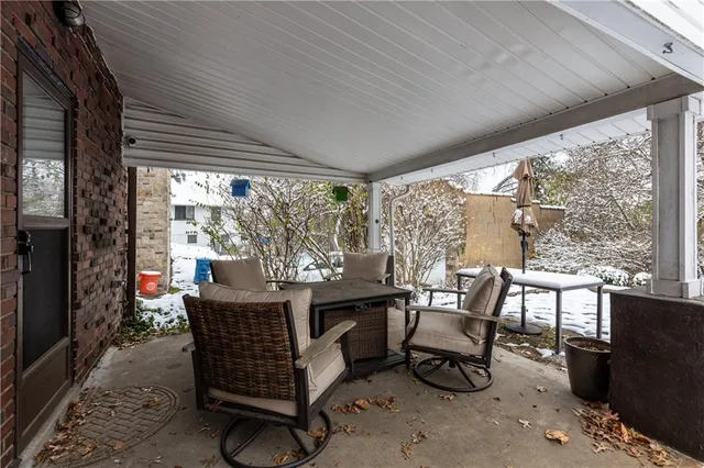 a dining room with furniture and windows