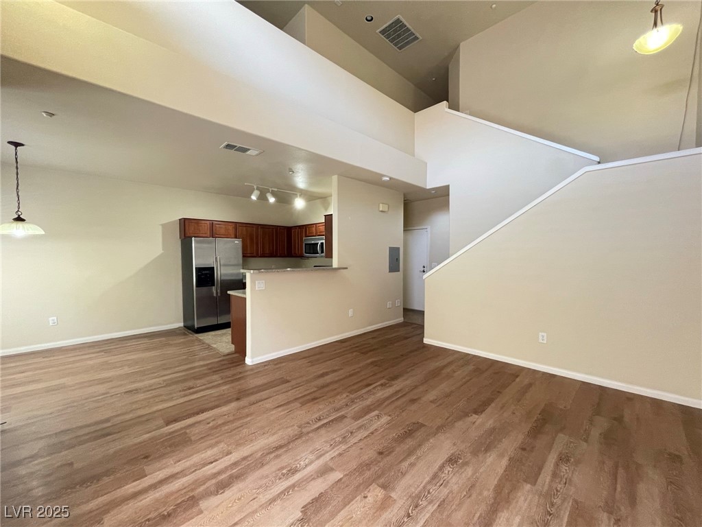 10519 Hedge View Avenue Las Vegas, NV 89129 - Photo 14 of 39 Unfurnished living room with visible vents, light