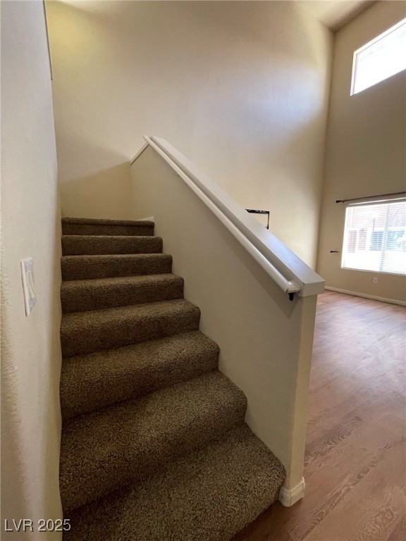 10519 Hedge View Avenue Las Vegas, NV 89129 - Photo 17 of 39 Staircase featuring a high ceiling, plenty of natu