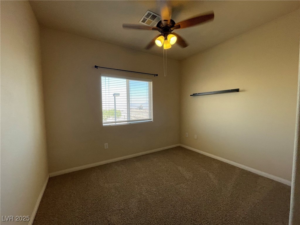 10519 Hedge View Avenue Las Vegas, NV 89129 - Photo 24 of 39 Carpeted spare room featuring baseboards and a cei
