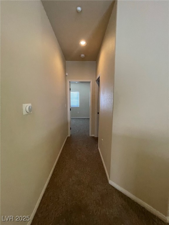 10519 Hedge View Avenue Las Vegas, NV 89129 - Photo 29 of 39 Hallway featuring carpet flooring and baseboards