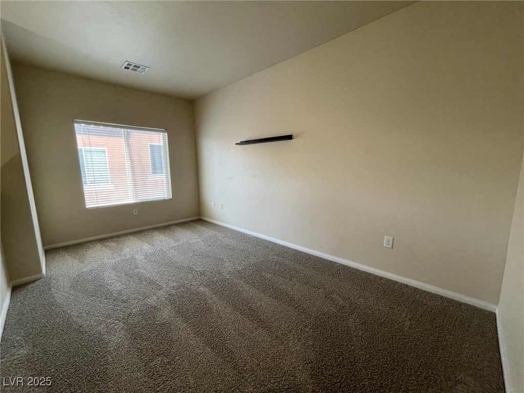 10519 Hedge View Avenue Las Vegas, NV 89129 - Photo 32 of 39 Unfurnished room with baseboards, visible vents, a