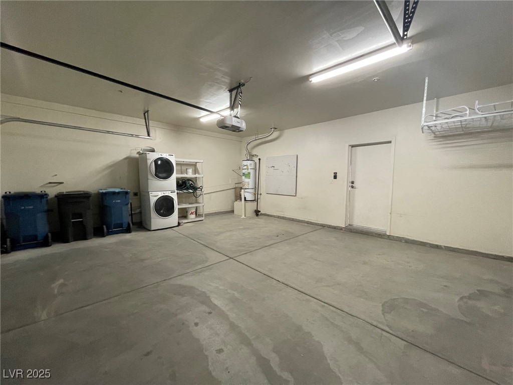 10519 Hedge View Avenue Las Vegas, NV 89129 - Photo 34 of 39 Garage featuring water heater, stacked washer and