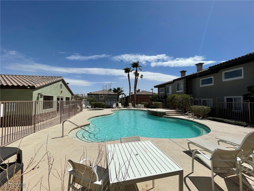 10519 Hedge View Avenue Las Vegas, NV 89129 - Photo 38 of 39 Community pool featuring a patio and fence
