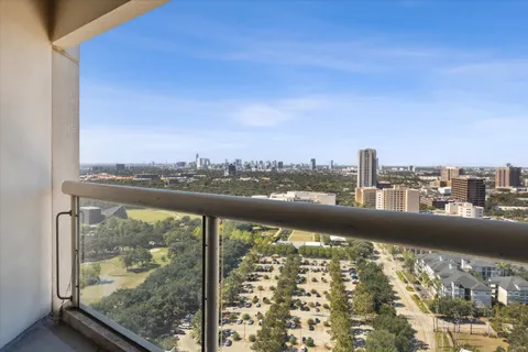 a view of a city skyline from a balcony