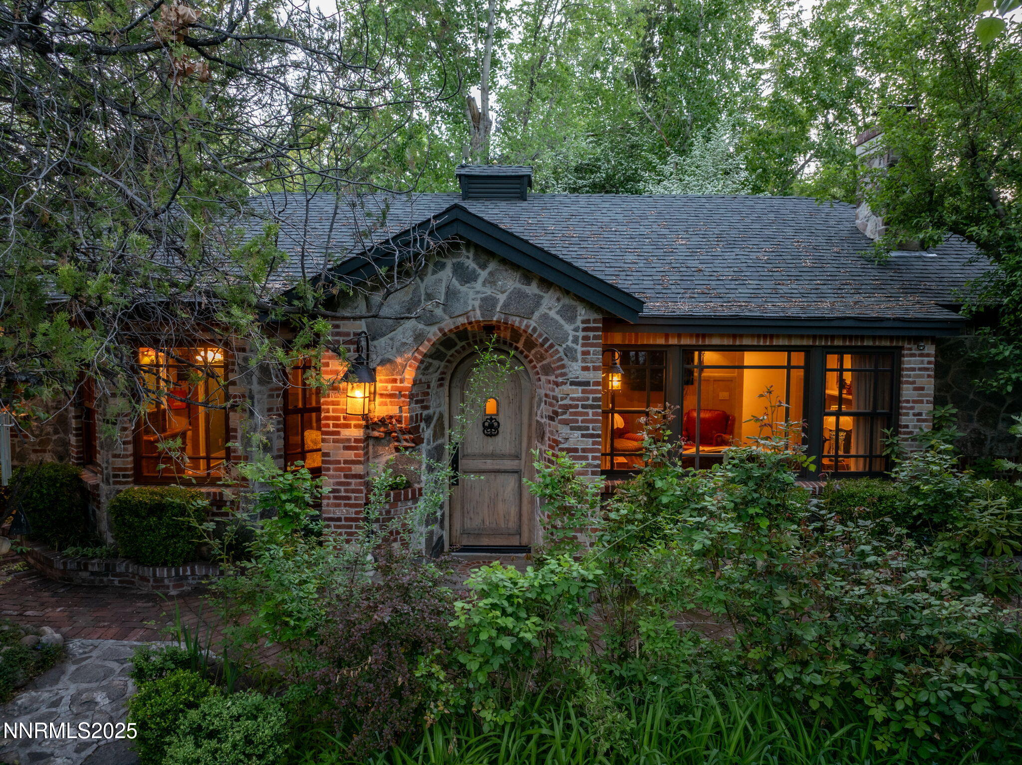 1555 Marsh Avenue Reno, NV 89509 - Photo 1 of 84 a backyard of a house with plants and outdoor seating