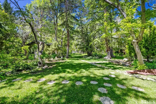 a view of a livingroom with furniture and windows