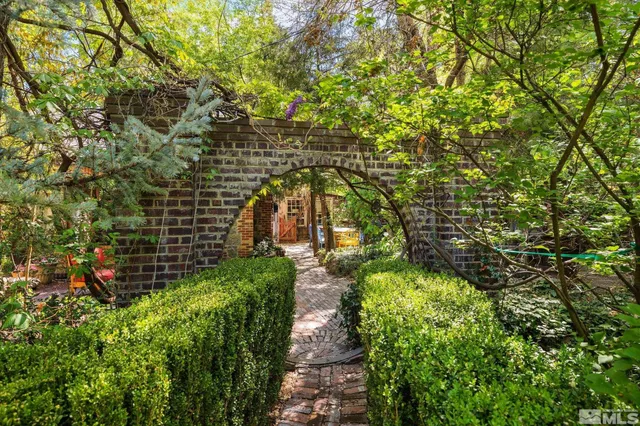 a bathroom with a glass shower door and a toilet