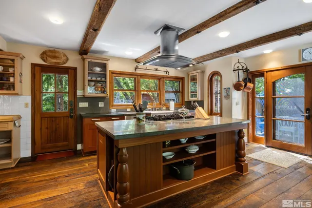 a kitchen with stainless steel appliances granite countertop a stove and a sink