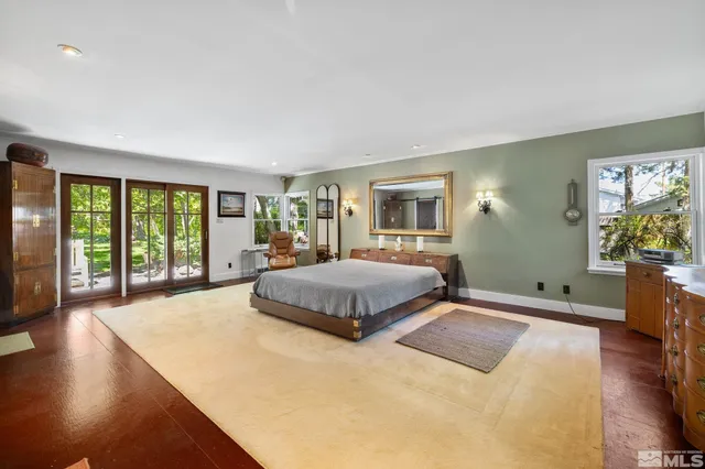 a view of a dining room with furniture and a kitchen