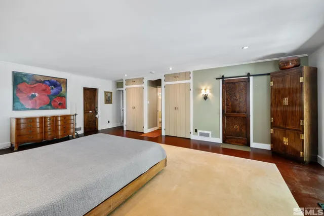 a kitchen with stainless steel appliances a stove a microwave a sink and cabinets