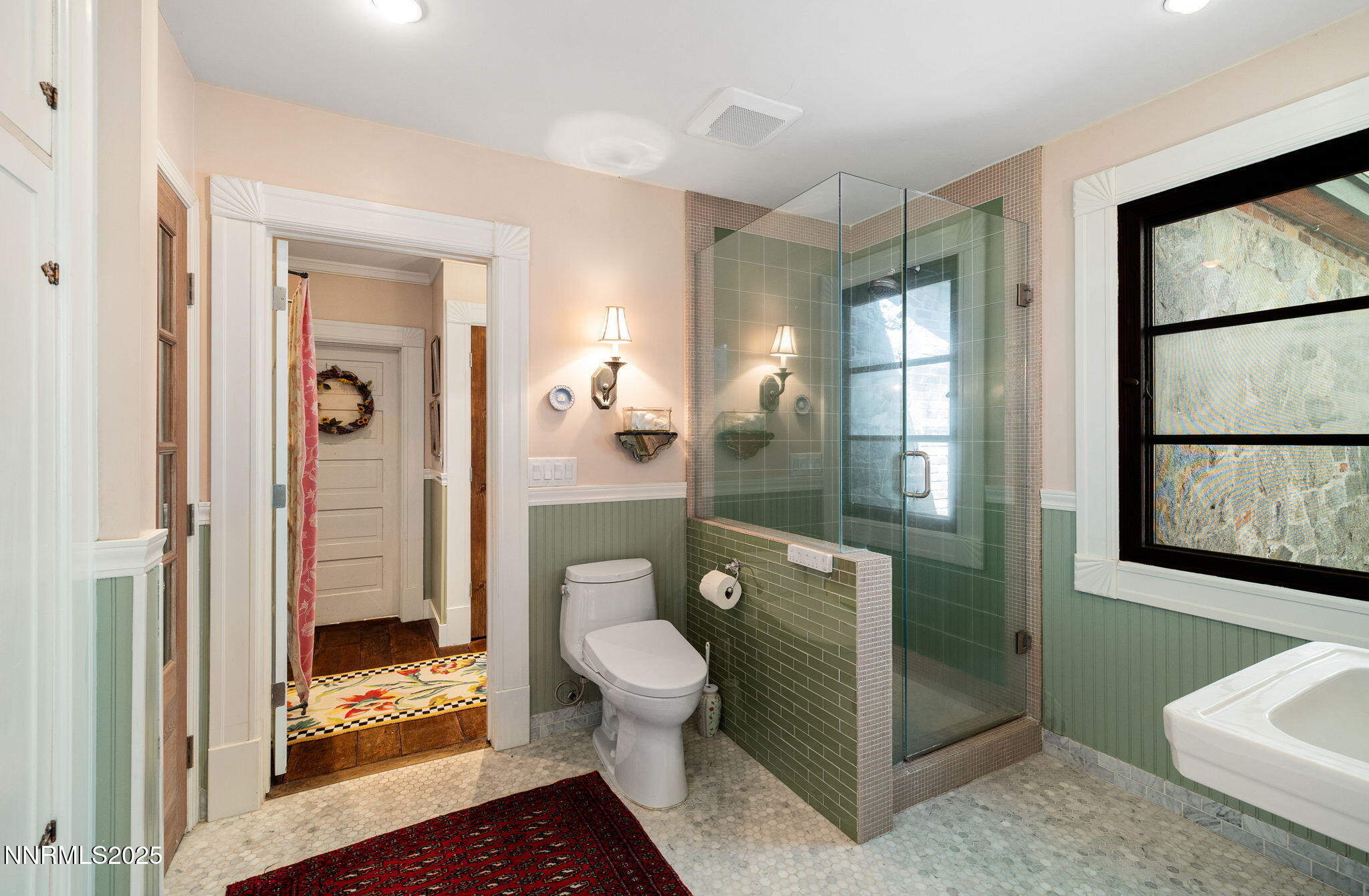 1555 Marsh Avenue Reno, NV 89509 - Photo 34 of 84 a bathroom with a glass shower door and a toilet