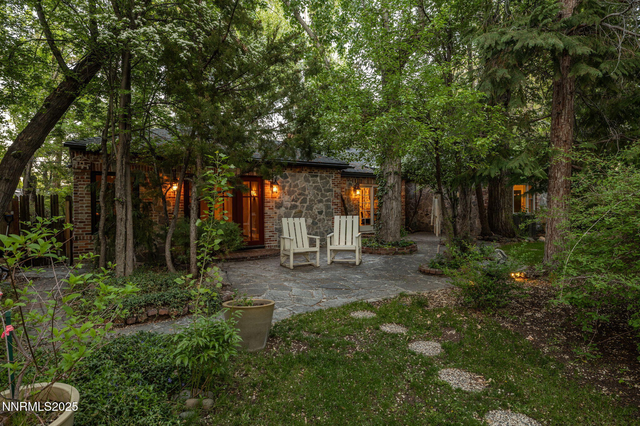 1555 Marsh Avenue Reno, NV 89509 - Photo 43 of 84 a view of a patio with table and chairs and potted plants and large trees