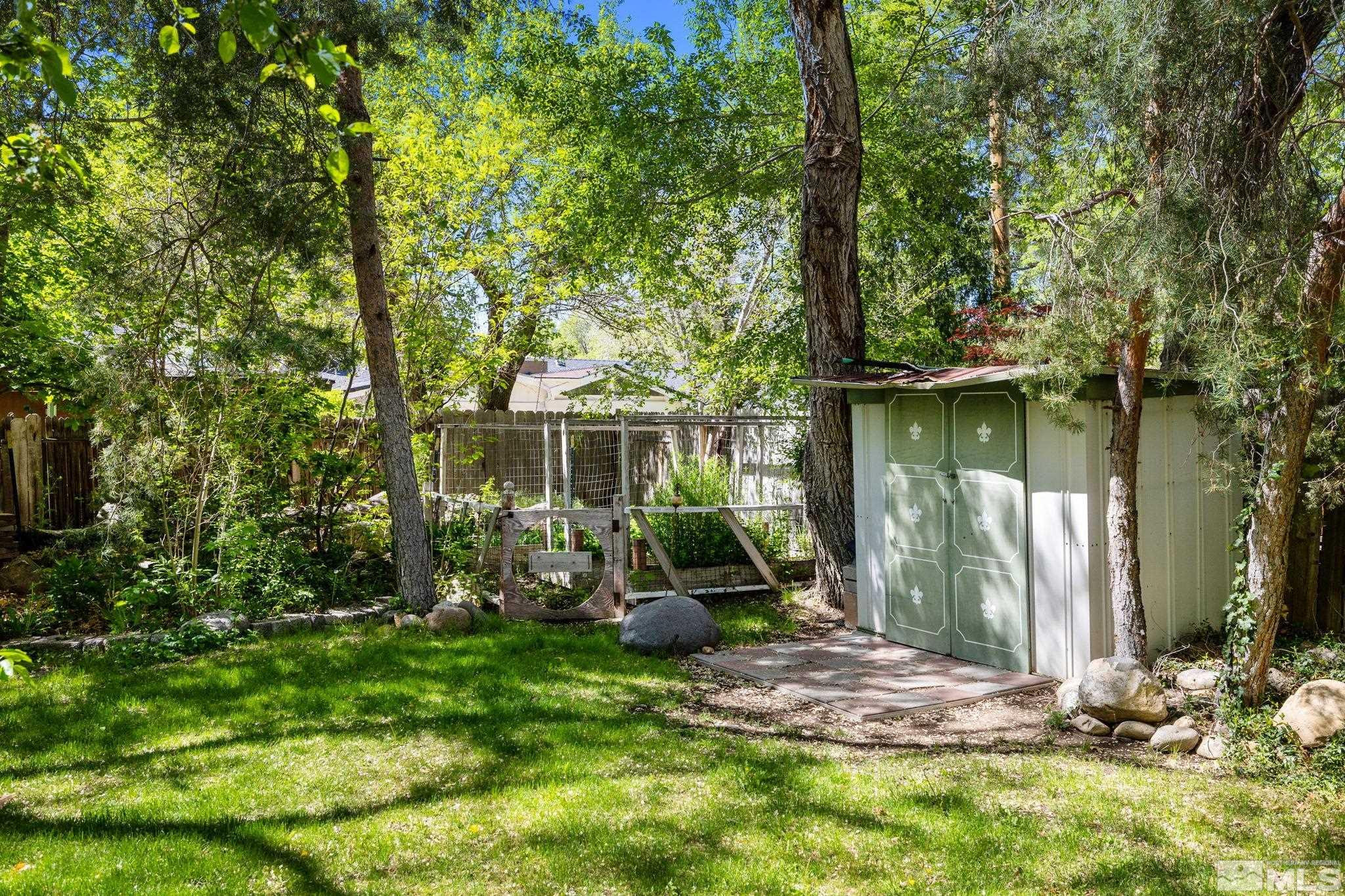 1555 Marsh Avenue Reno, NV 89509 - Photo 45 of 84 a view of a chair and table in backyard of the house