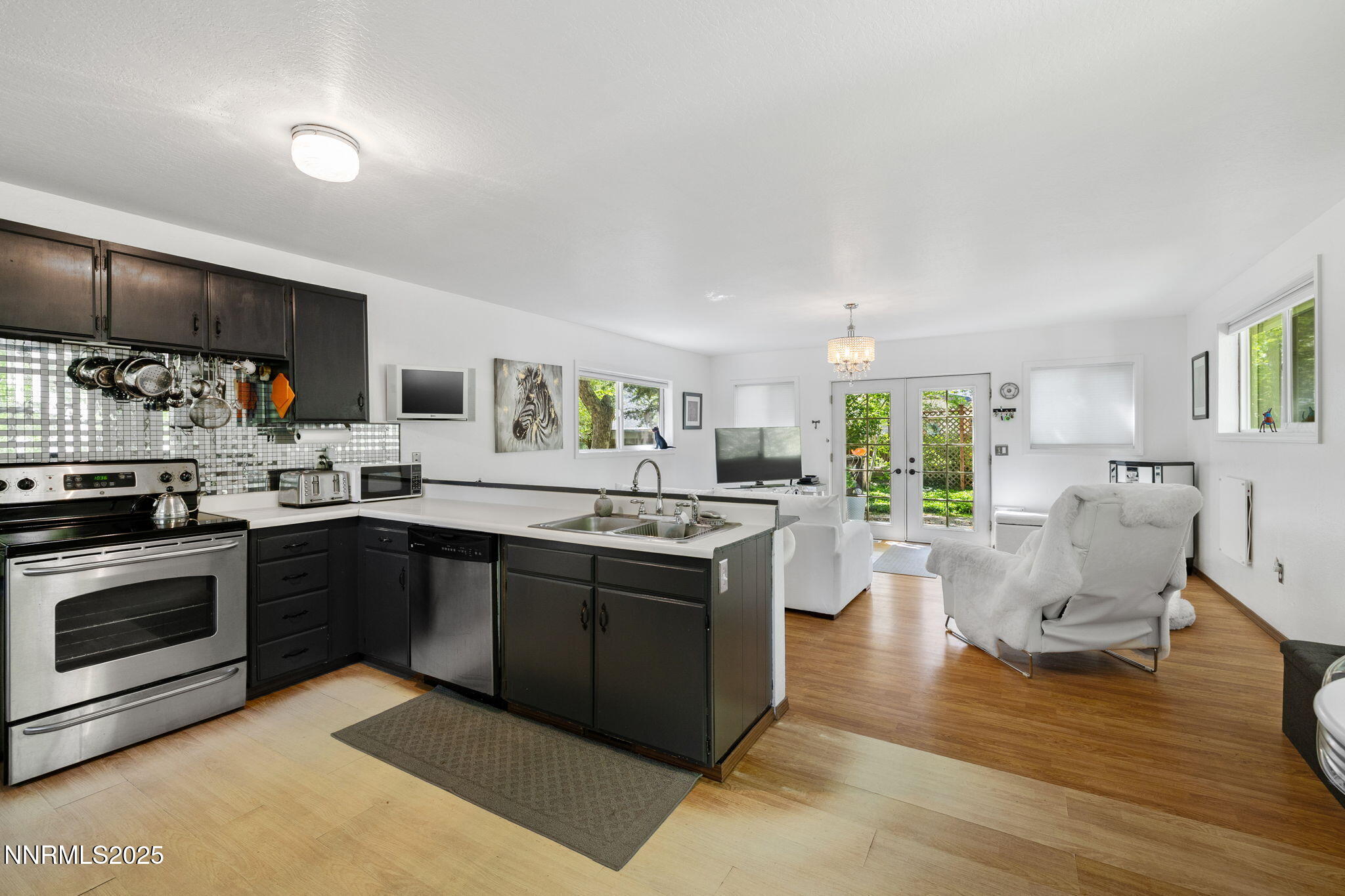 1555 Marsh Avenue Reno, NV 89509 - Photo 54 of 84 a kitchen with stainless steel appliances granite countertop a stove and a sink