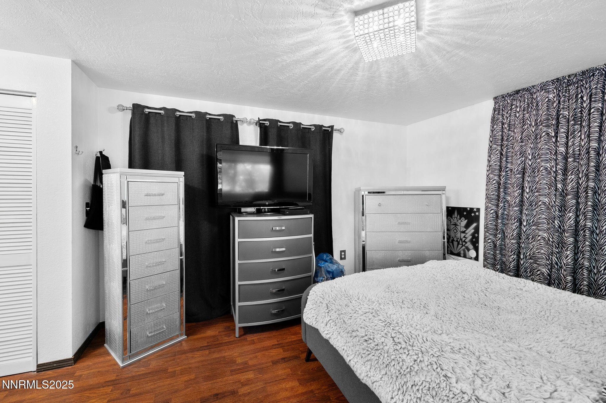 1555 Marsh Avenue Reno, NV 89509 - Photo 57 of 84 a bedroom with a bed and a television