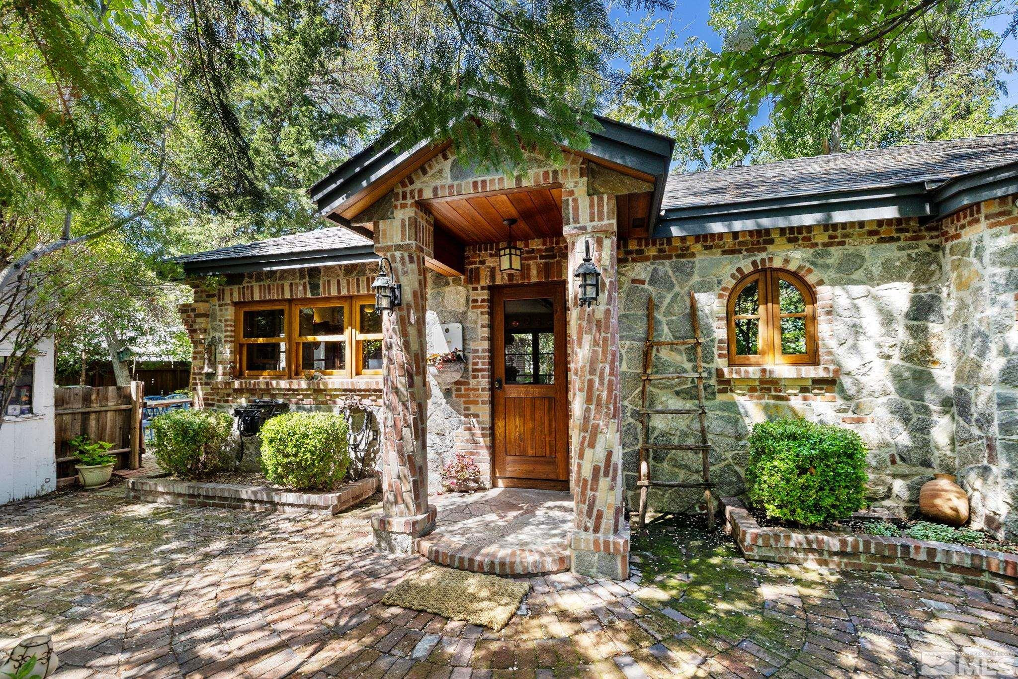 1555 Marsh Avenue Reno, NV 89509 - Photo 7 of 84 a view of a house with potted plants
