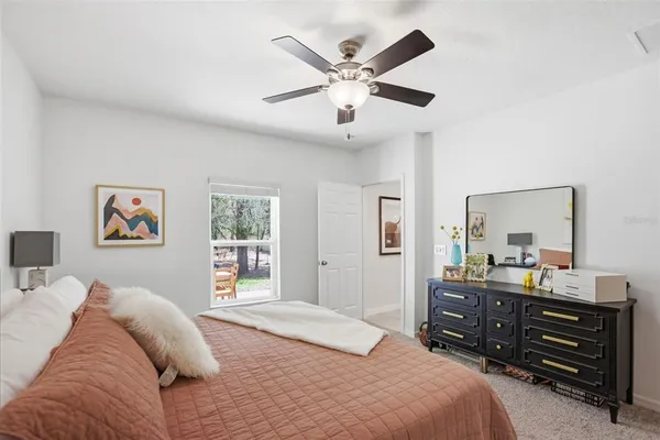 a bedroom with a bed and a dresser
