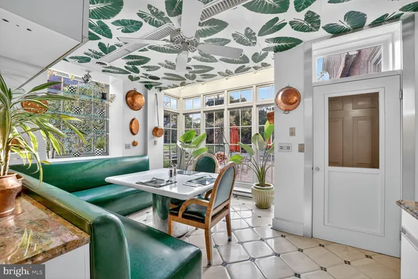 a outdoor dining area with furniture and window