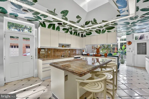 a kitchen with a table and appliances