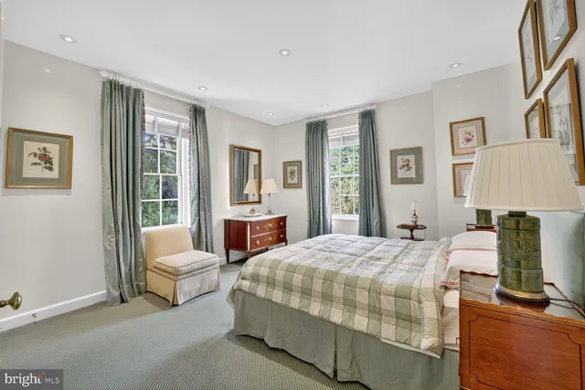 a bedroom with a bed and a couch