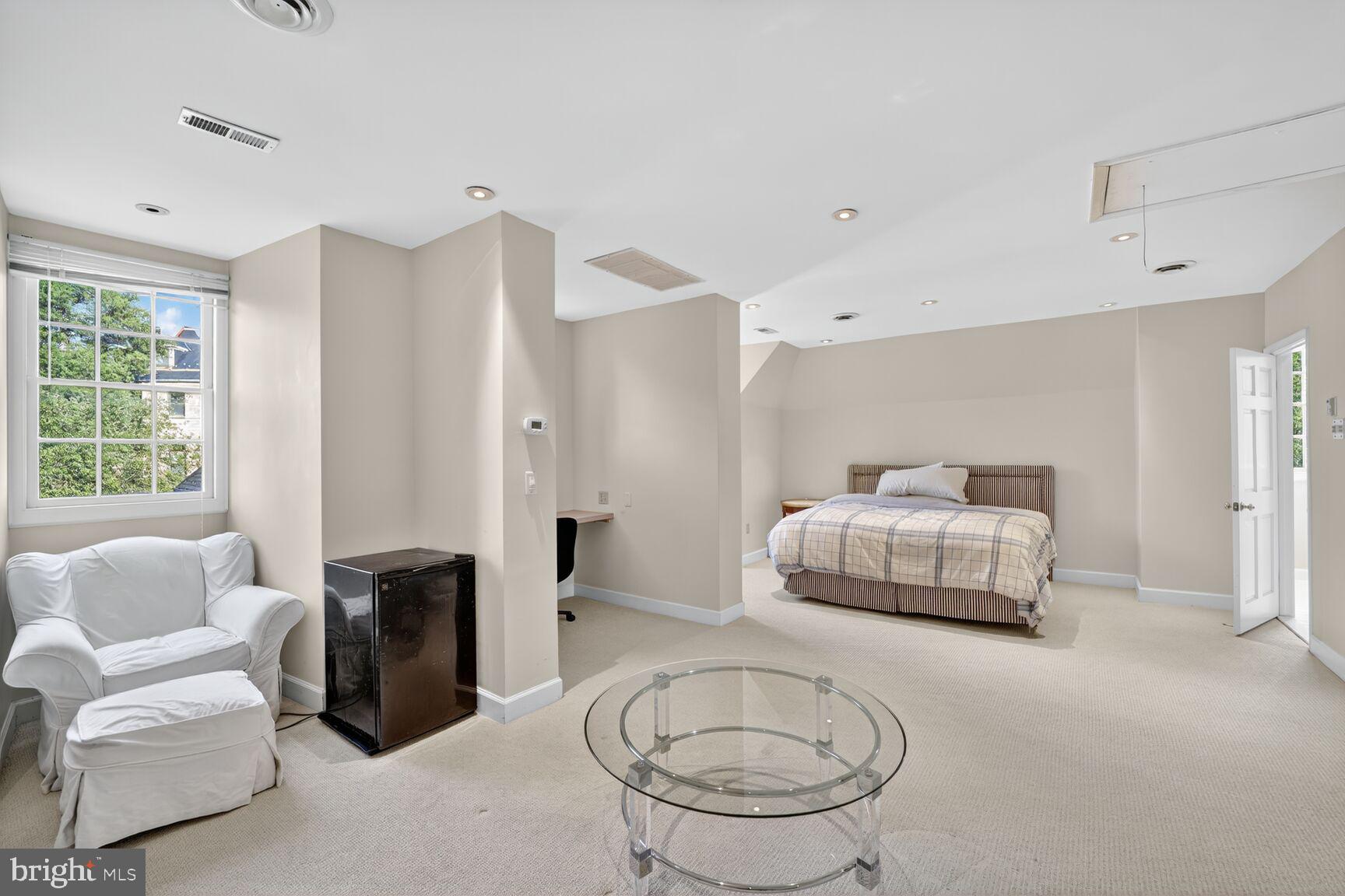 2310 Kalorama Road Northwest Washington, DC 20008 - Photo 29 of 50 a bedroom with furniture and a large window