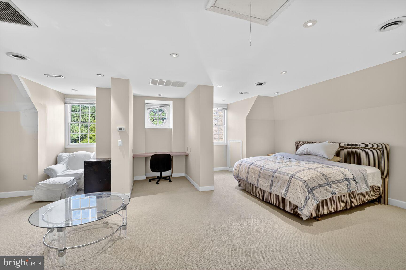 2310 Kalorama Road Northwest Washington, DC 20008 - Photo 30 of 50 a spacious bedroom with a bed and furniture