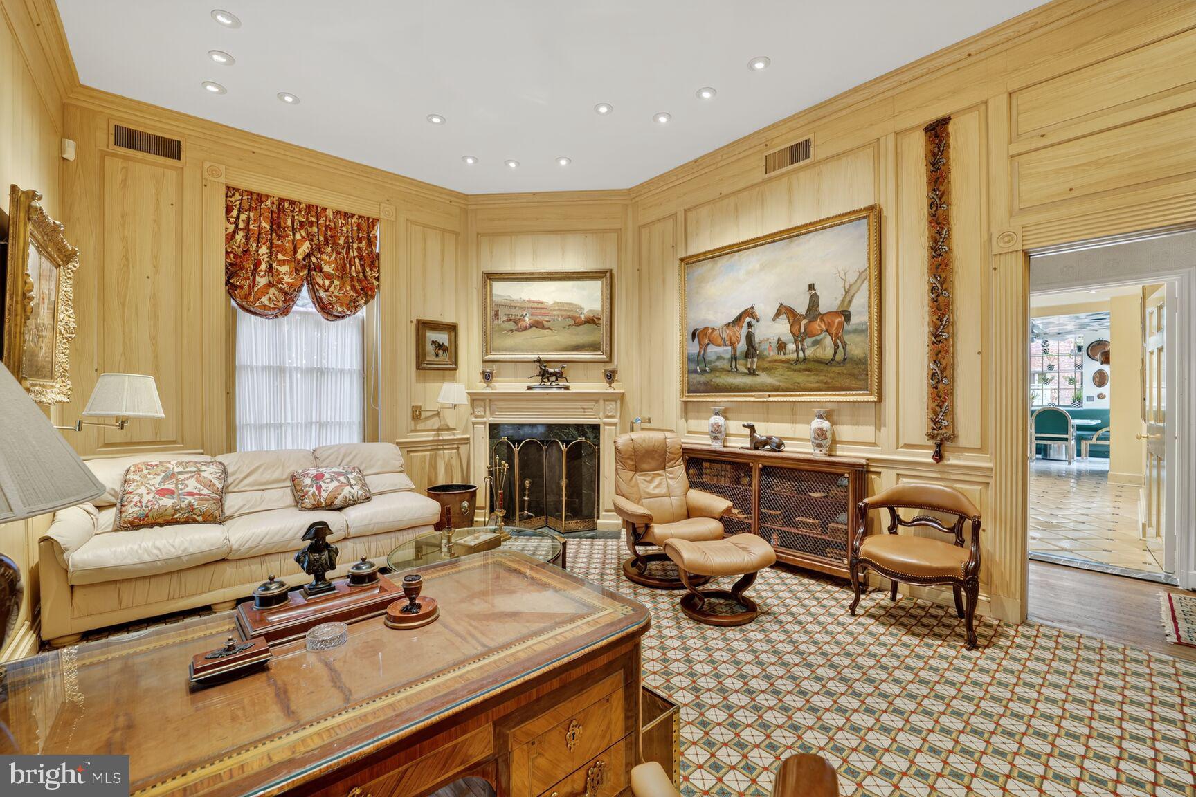 2310 Kalorama Road Northwest Washington, DC 20008 - Photo 32 of 50 a living room with furniture a rug and a fireplace