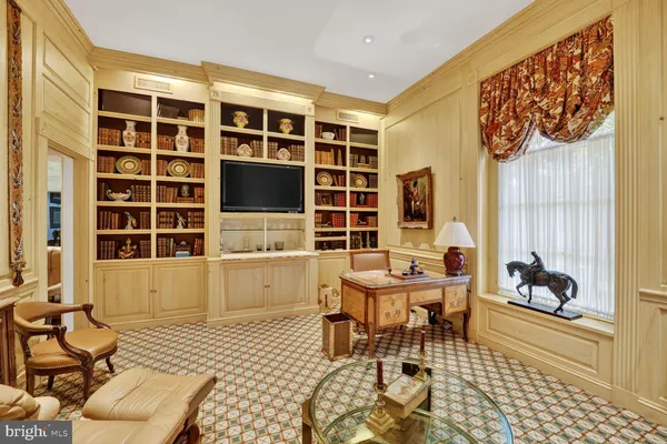 a balcony with furniture and a potted plant