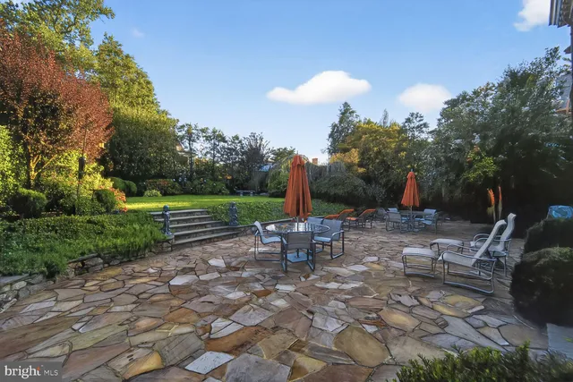 a view of a sitting area with furniture and wooden fence