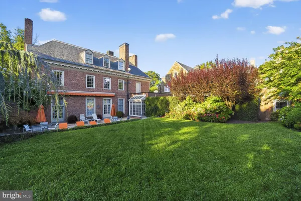 a view of a house with a yard porch and sitting area