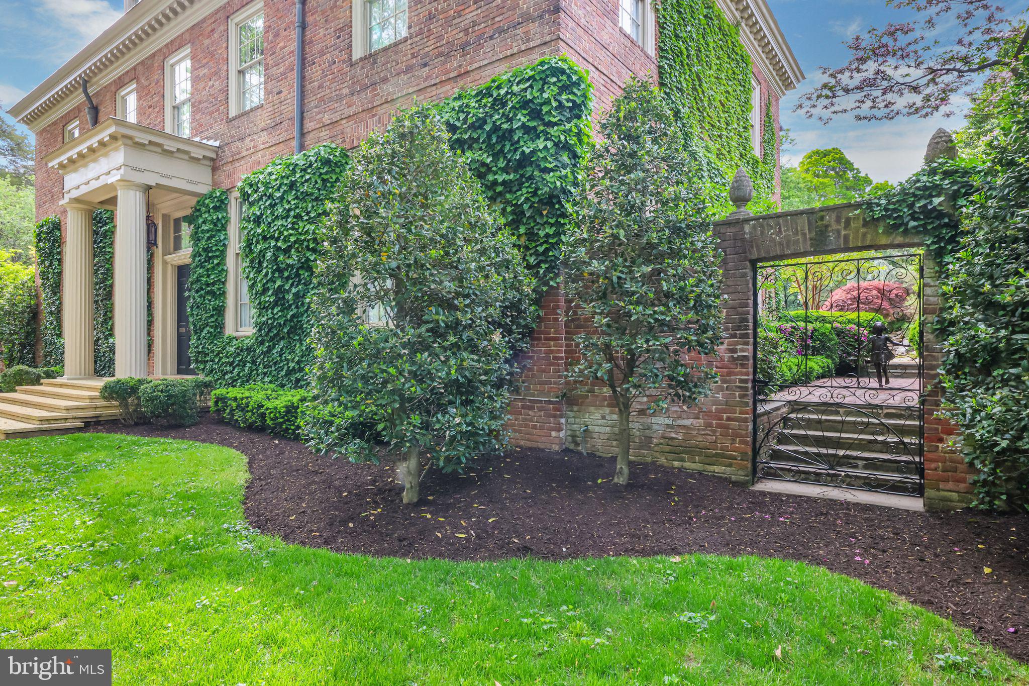 2310 Kalorama Road Northwest Washington, DC 20008 - Photo 42 of 50 a backyard of a house with plants and outdoor seating