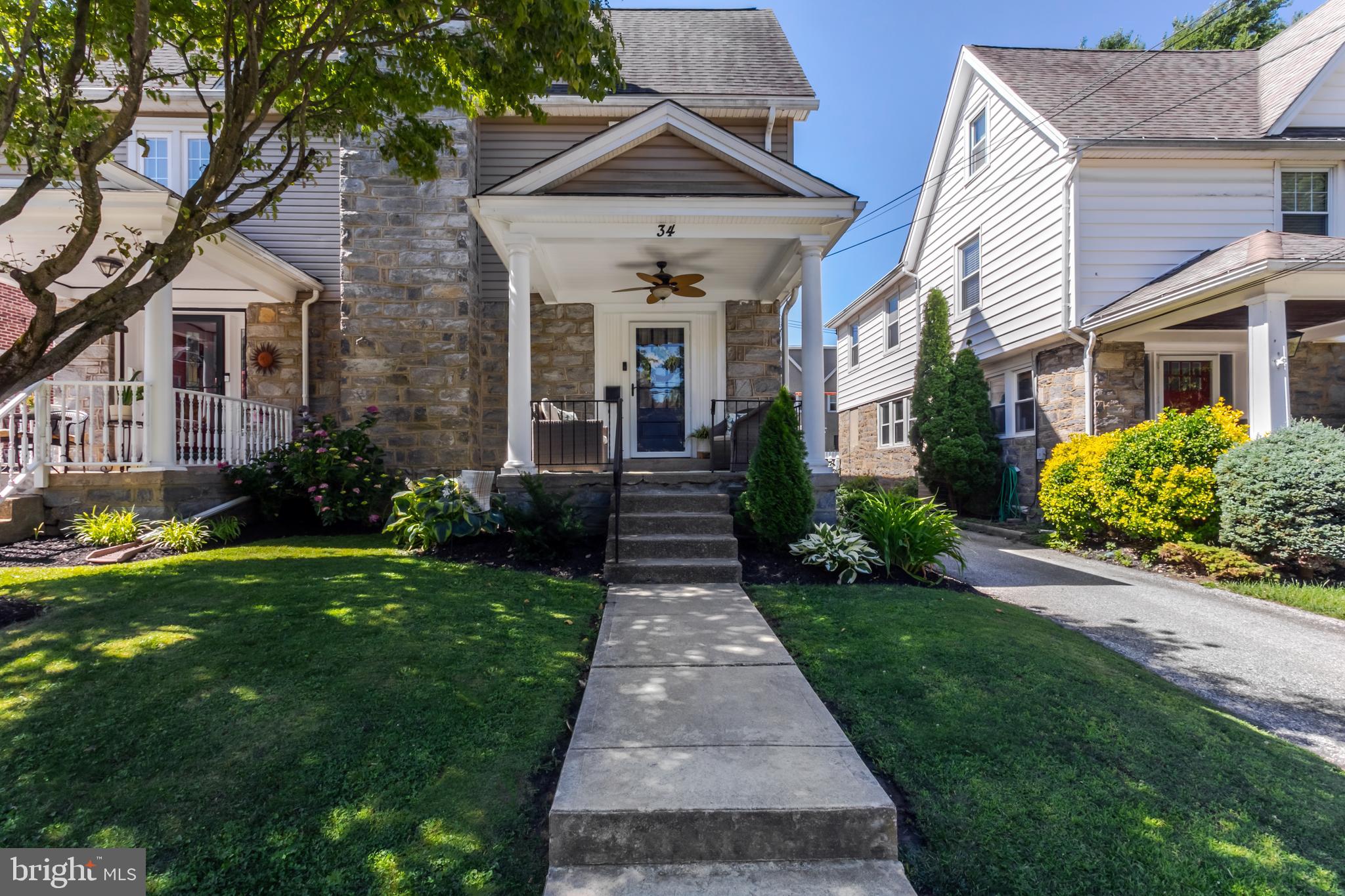 34 Greenhill Road Springfield, PA 19064 - Photo 1 of 36 a front view of a house with garden