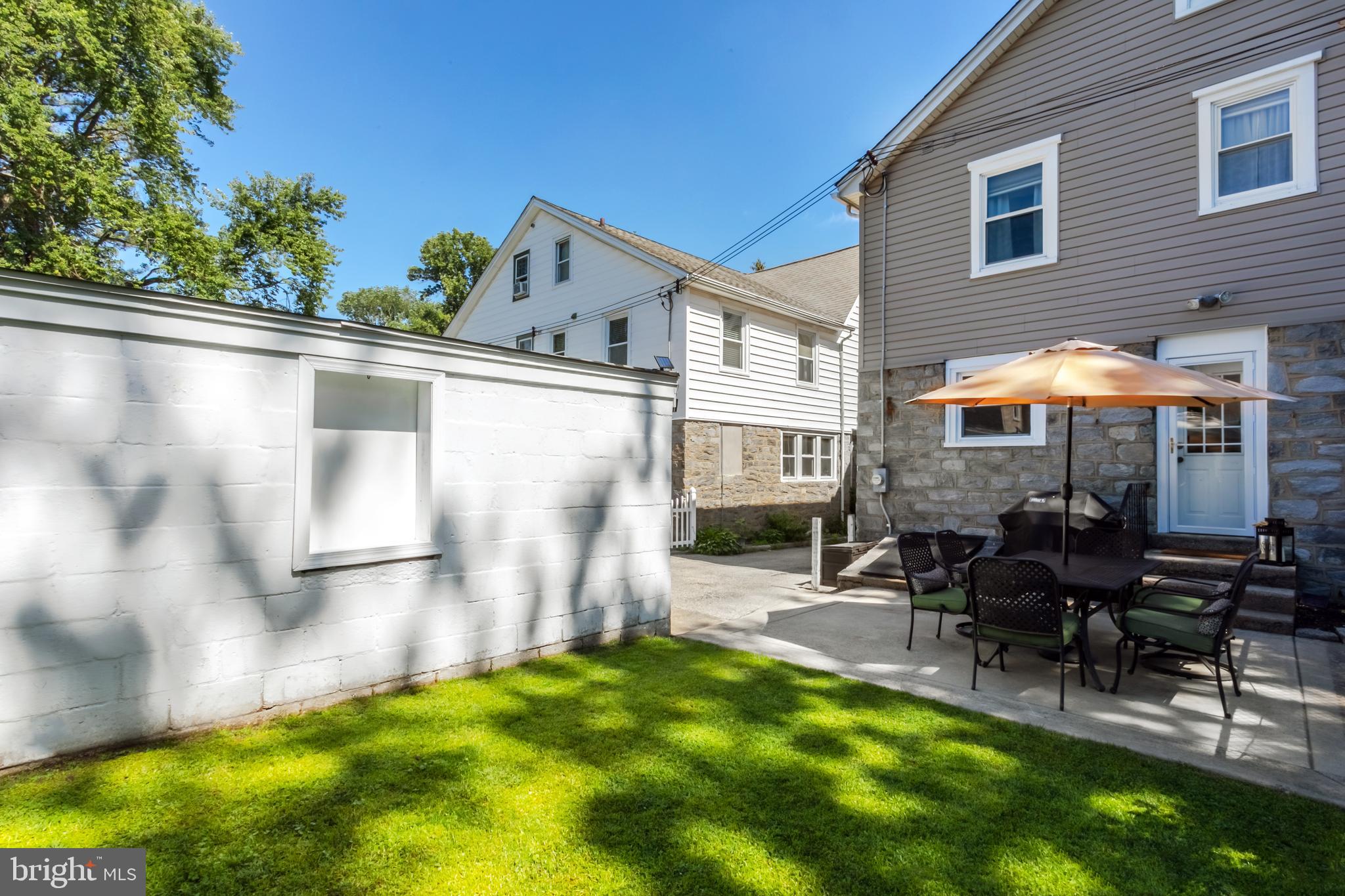 34 Greenhill Road Springfield, PA 19064 - Photo 36 of 36 a backyard of a house with yard and outdoor seating