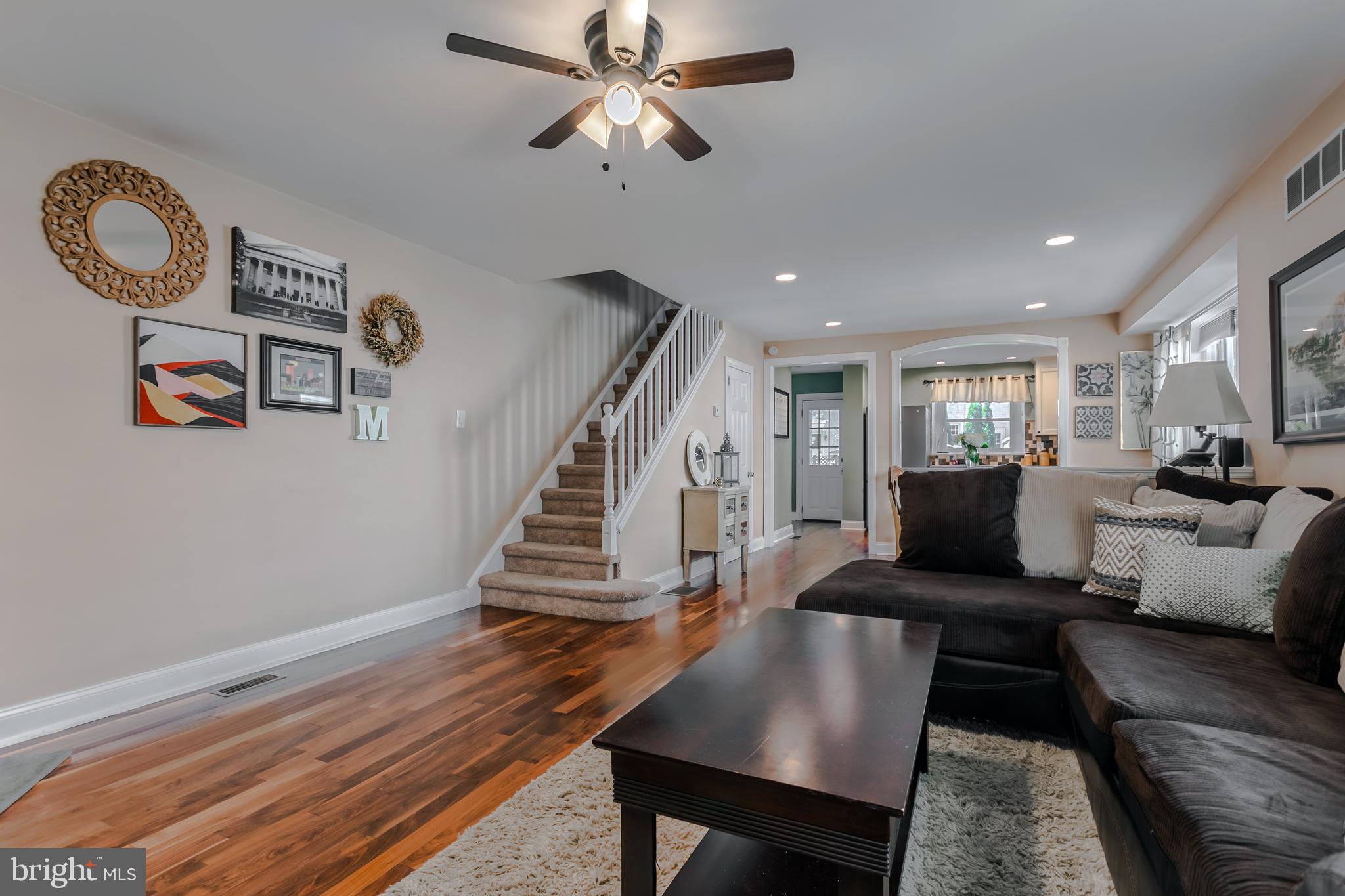 34 Greenhill Road Springfield, PA 19064 - Photo 6 of 36 a living room with couches chairs and a dining table with wooden floor