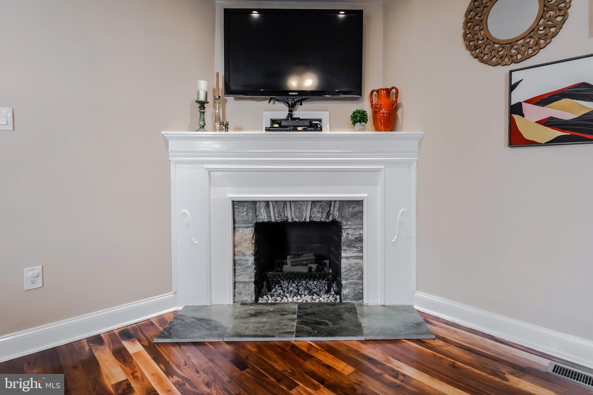 34 Greenhill Road Springfield, PA 19064 - Photo 9 of 36 a living room with furniture and a fireplace